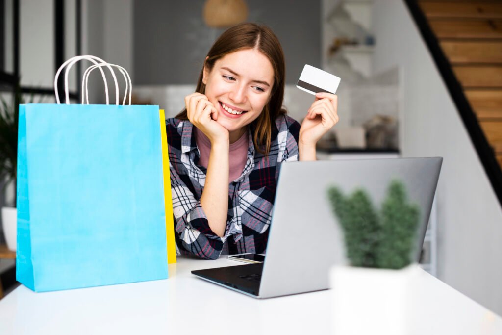 Woman completing checkout on laptop representing visitor to client conversion through effective web design - by Horizon WP Services